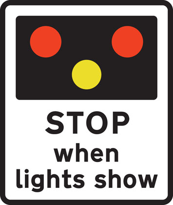 Traffic Sign - Light signals ahead at level crossing, airfield or bridge